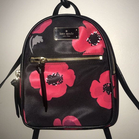 kate spade Handbags - KATE SPADE BLACK AND RED FLOWER MINI BACKPACK 🥀